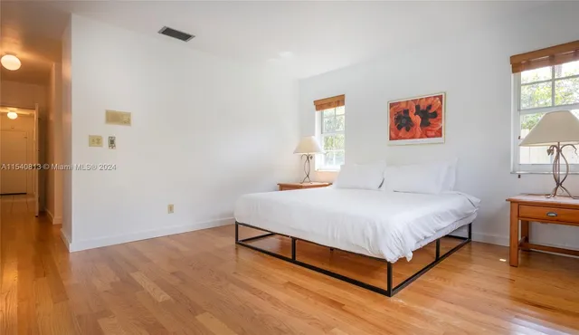 a bedroom with furniture and a window