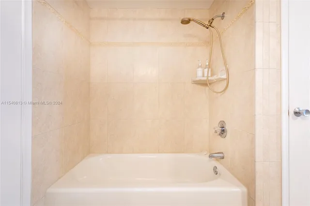 a living room with a bed furniture and a window