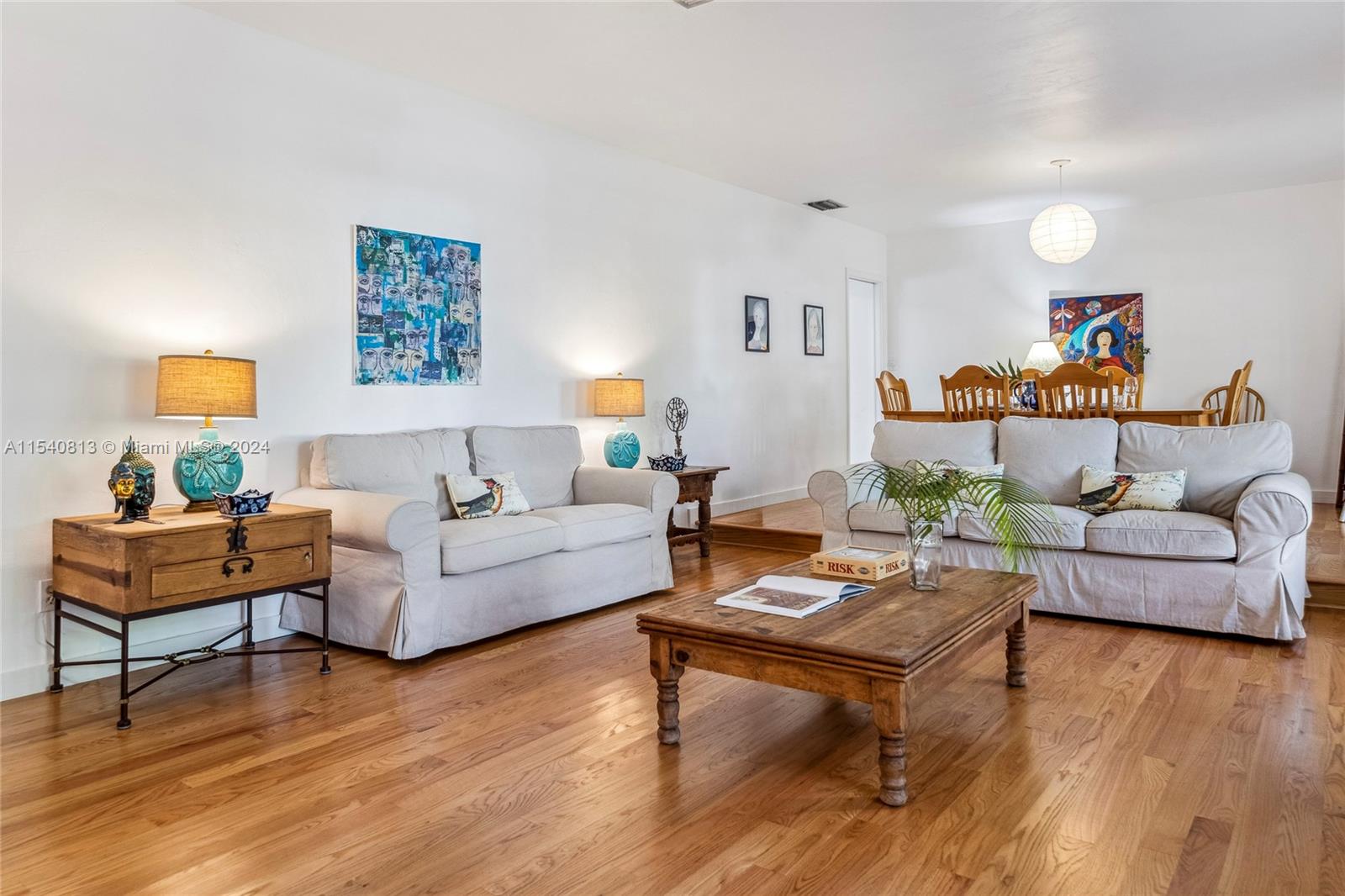 10130 Southwest 70th Avenue Pinecrest, FL 33156 - Photo 3 of 75 a living room with furniture and a wooden floor