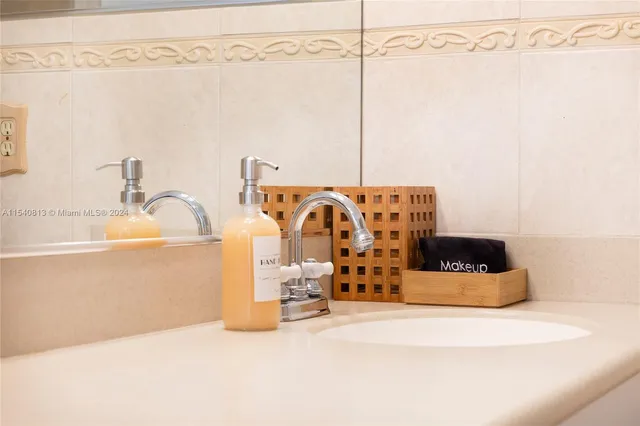 a bedroom with a bed and a view of walk in closet