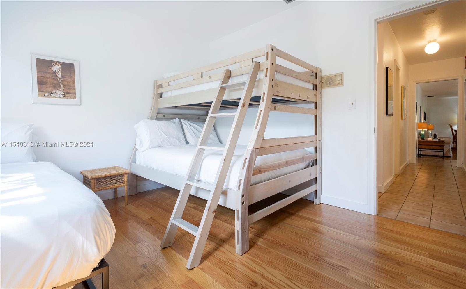 10130 Southwest 70th Avenue Pinecrest, FL 33156 - Photo 43 of 75 a bedroom with a bed and a view of walk in closet