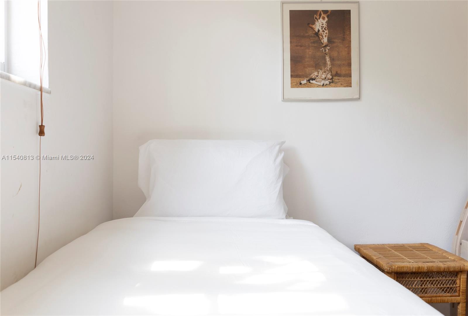 10130 Southwest 70th Avenue Pinecrest, FL 33156 - Photo 44 of 75 a bedroom with a bed and wall painting