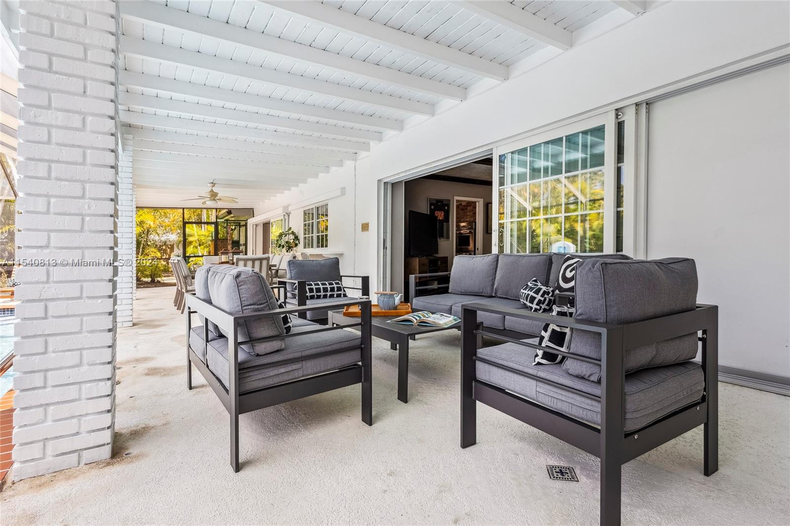 10130 Southwest 70th Avenue Pinecrest, FL 33156 - Photo 52 of 75 a living room with furniture and a large window