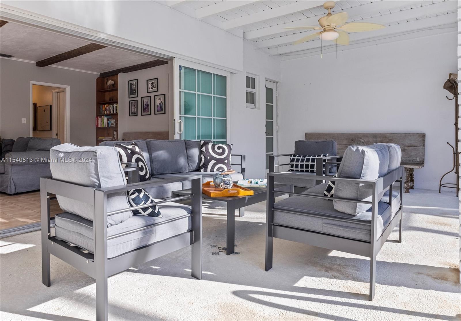 10130 Southwest 70th Avenue Pinecrest, FL 33156 - Photo 53 of 75 a living room with furniture and a potted plant