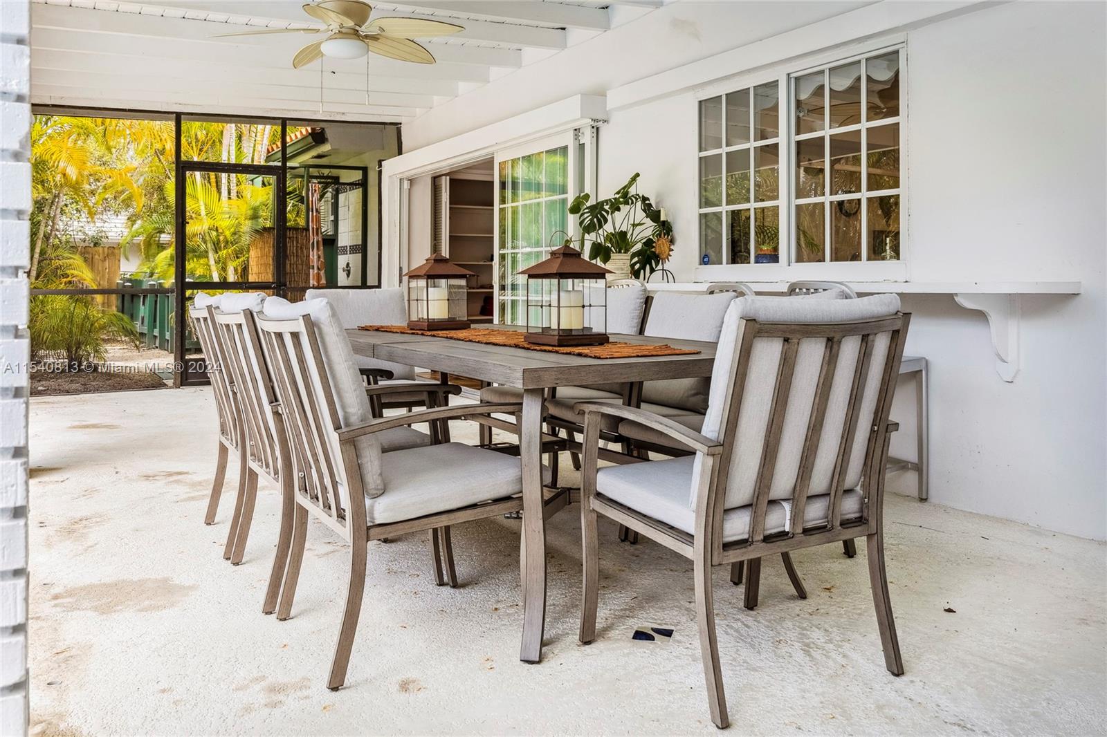 10130 Southwest 70th Avenue Pinecrest, FL 33156 - Photo 56 of 75 a view of a dining room with furniture window and outside view