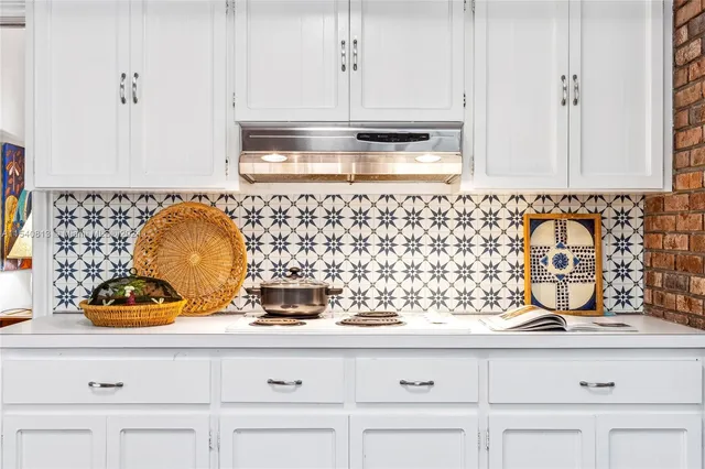 a living room with furniture and a book shelf