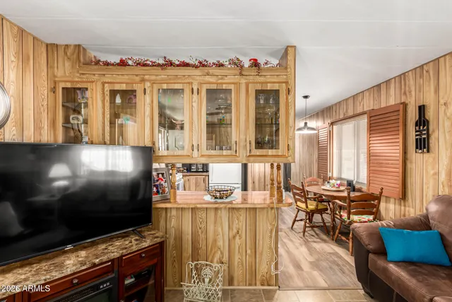 a living room with fireplace furniture and a flat screen tv