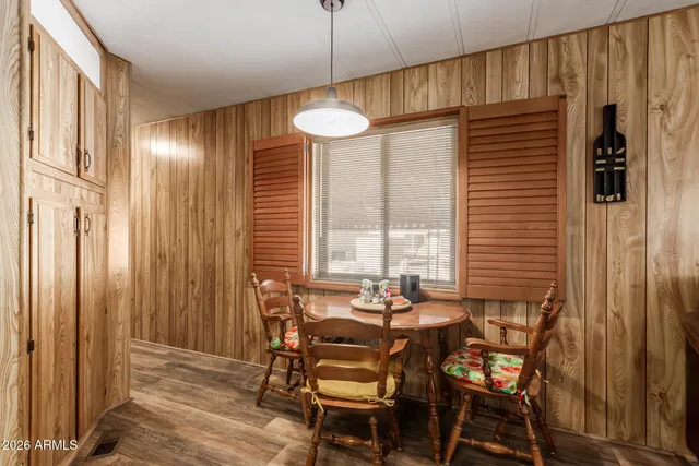 a view of a dining room with furniture and window