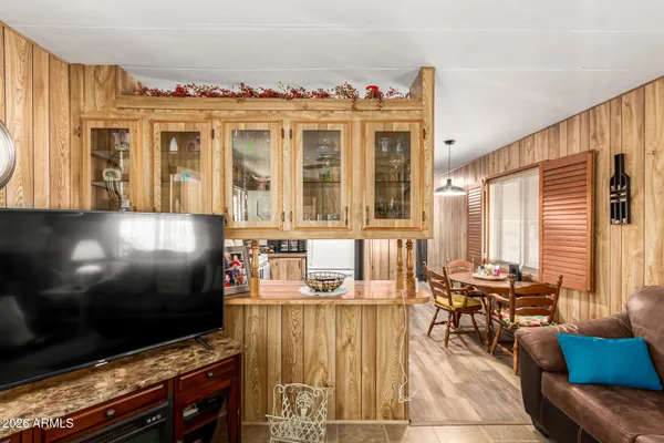 a living room with fireplace furniture and a flat screen tv