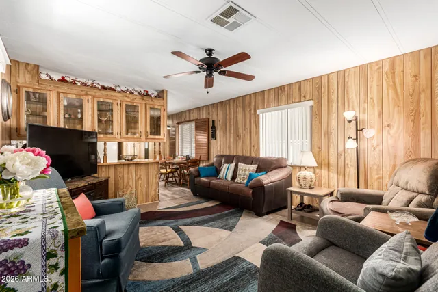 a living room with furniture and a large window