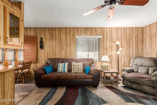 a living room with furniture and a window