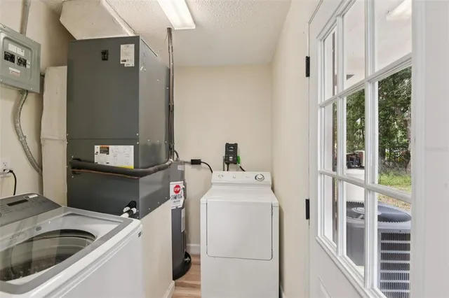 a utility room with dryer and washer