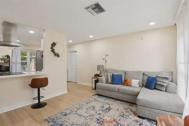 a living room with furniture and a rug