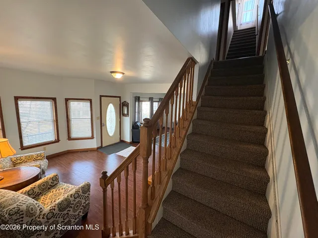 a bedroom with a bed and a large mirror