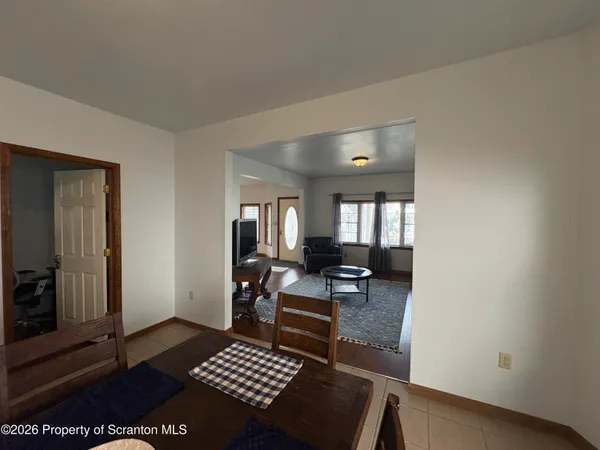 a living room with furniture and a rug