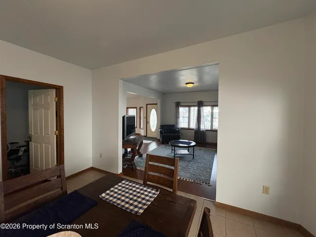 a living room with furniture and a rug