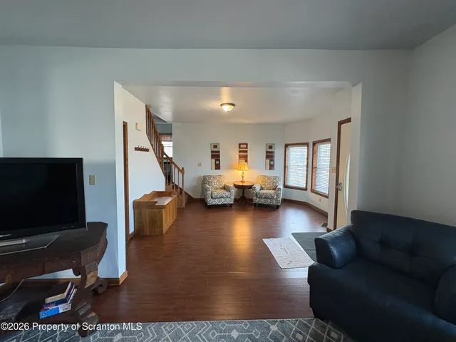 a view of a dining room with furniture and window