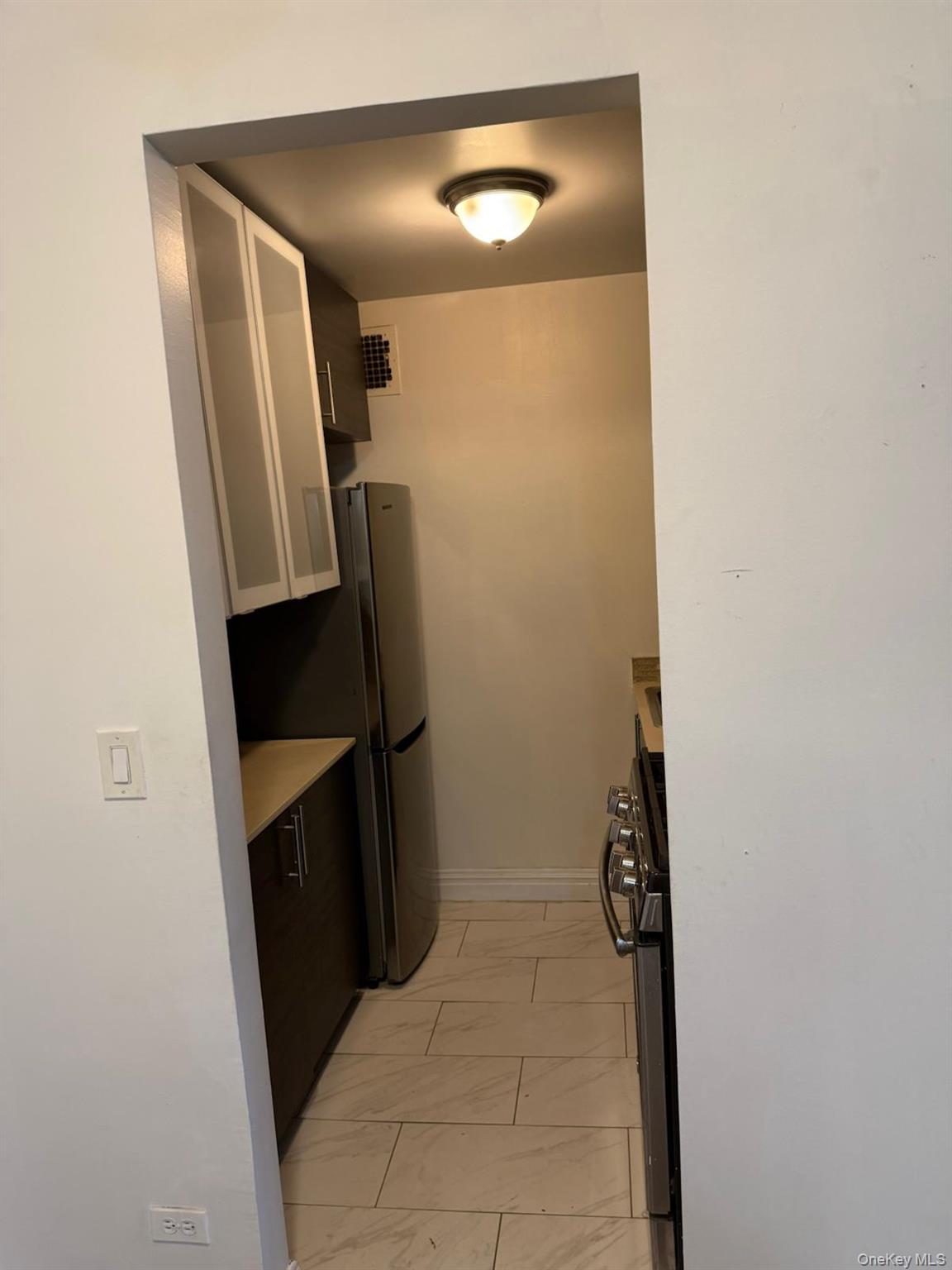 3520 Tryon Avenue, Unit 405 Bronx, NY 10467 - Photo 14 of 22 a bathroom with a sink and mirror