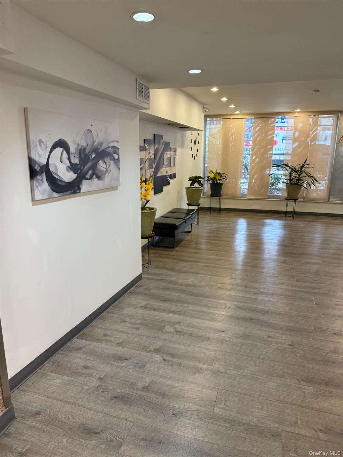 3520 Tryon Avenue, Unit 405 Bronx, NY 10467 - Photo 4 of 22 a view of a room with furniture and wooden floor