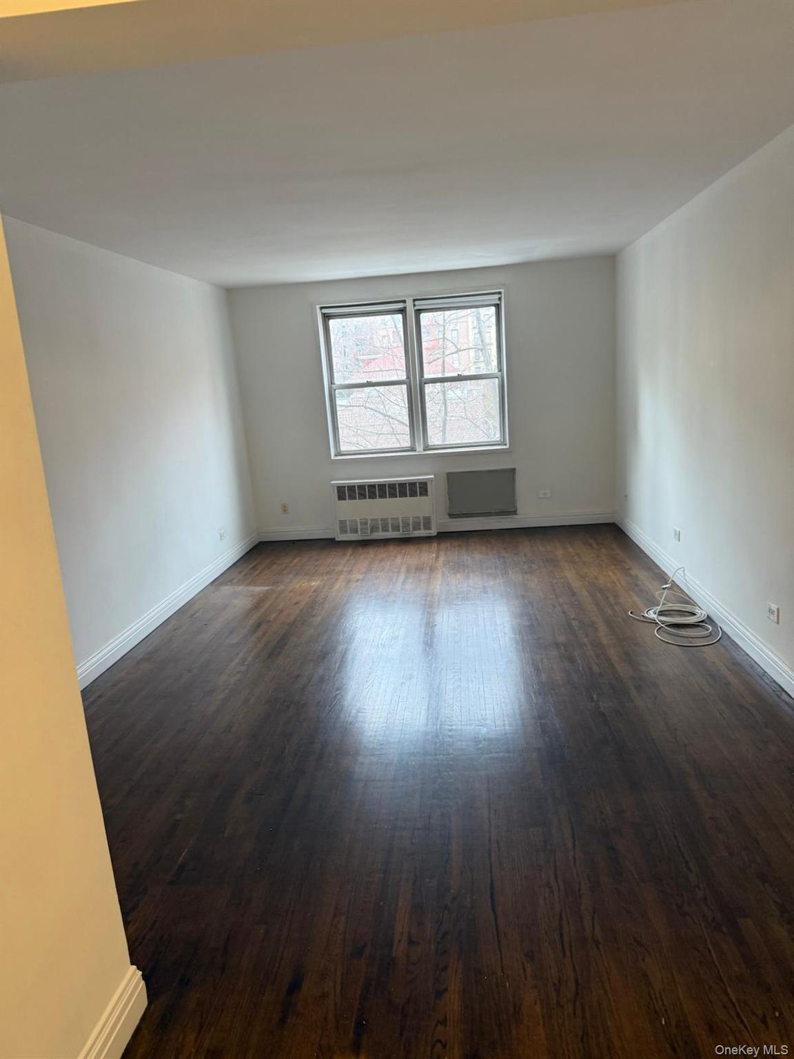3520 Tryon Avenue, Unit 405 Bronx, NY 10467 - Photo 9 of 22 a view of a room with wooden floor and windows