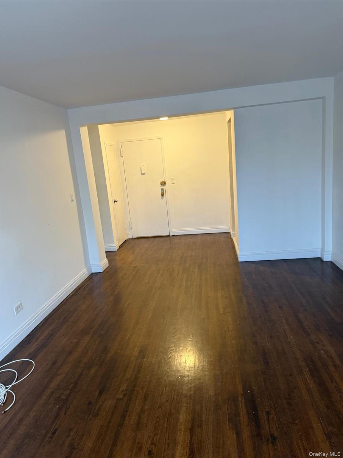 3520 Tryon Avenue, Unit 405 Bronx, NY 10467 - Photo 10 of 22 an empty room with wooden floor and windows