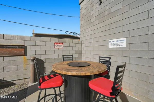 a view of a chairs and table in the patio