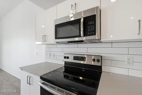 a kitchen with sink and window