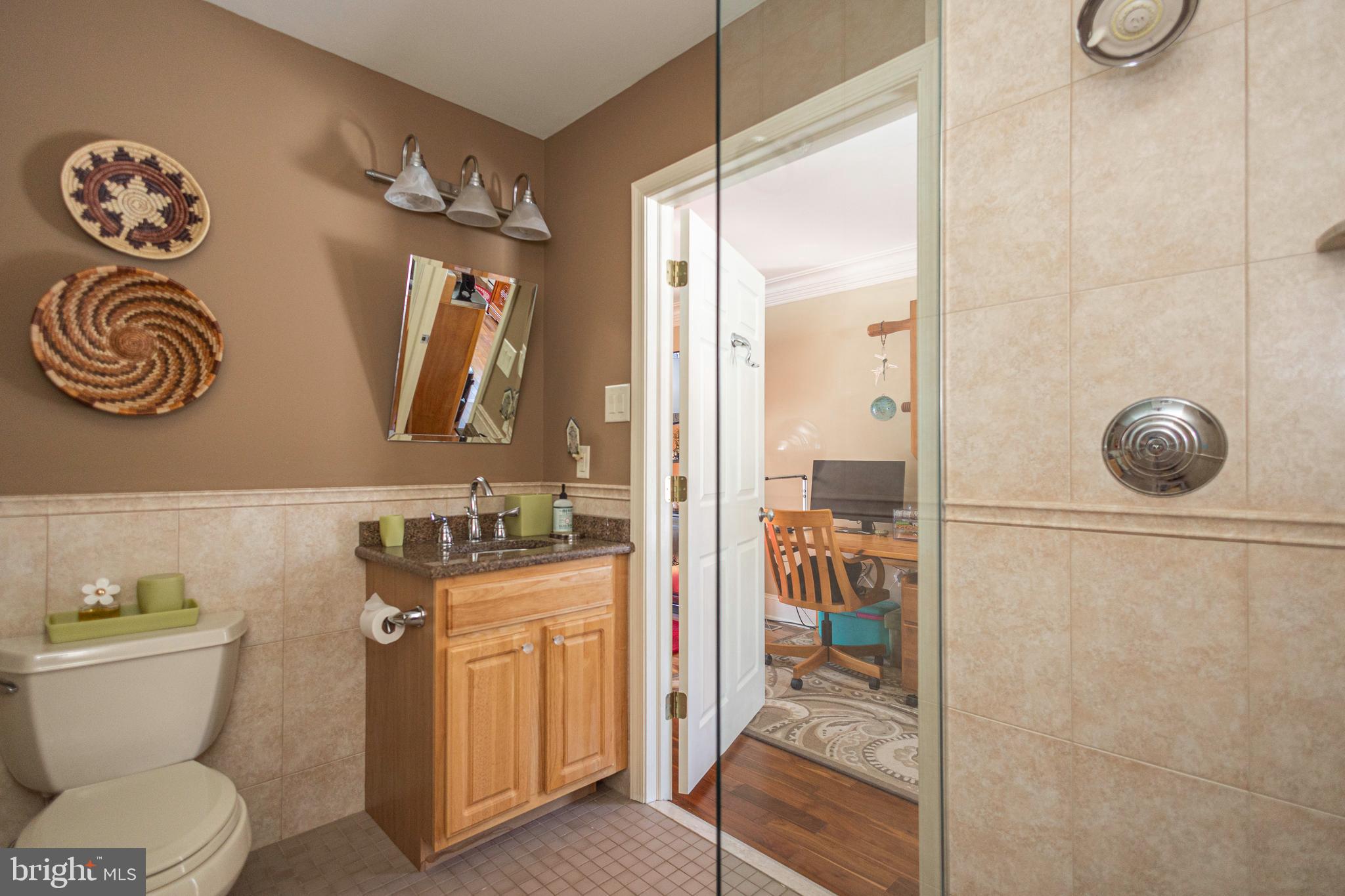 196 Aqueduct Road Washington Crossing, PA 18977 - Photo 17 of 57 a bathroom with a toilet a sink and a shower