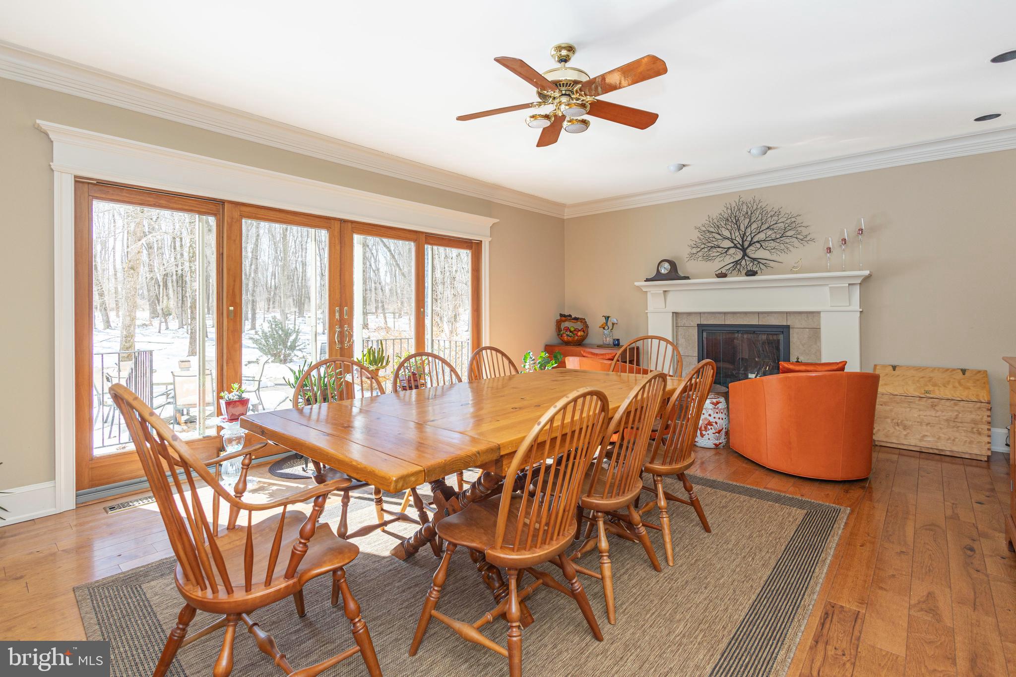 196 Aqueduct Road Washington Crossing, PA 18977 - Photo 18 of 57 a dining room with furniture a fireplace and wooden floor