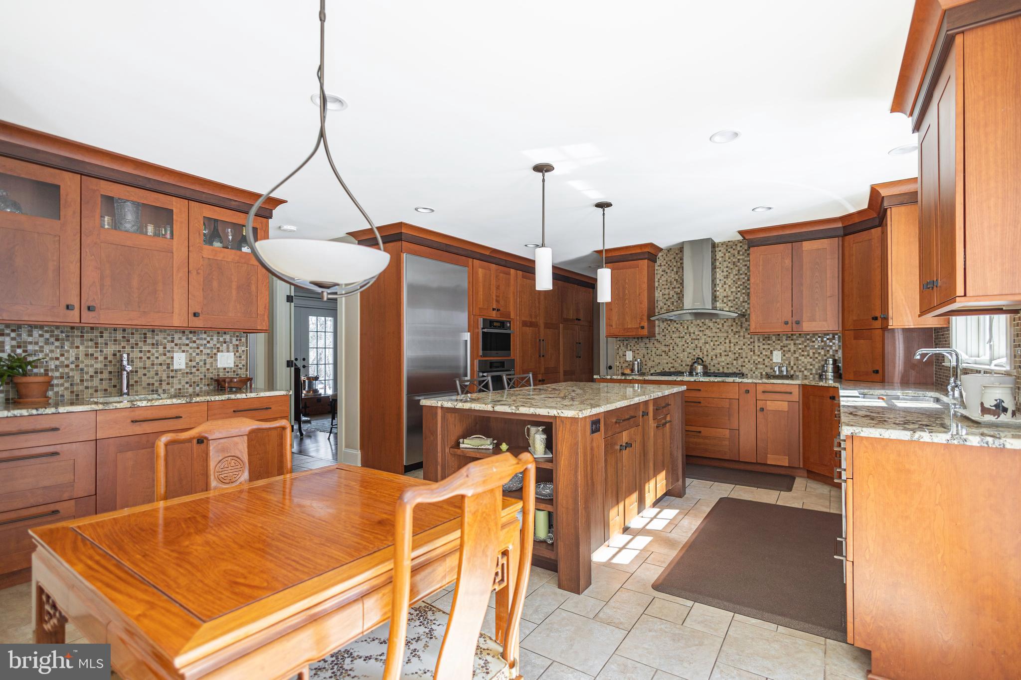 196 Aqueduct Road Washington Crossing, PA 18977 - Photo 26 of 57 a kitchen with stainless steel appliances granite countertop a sink and cabinets
