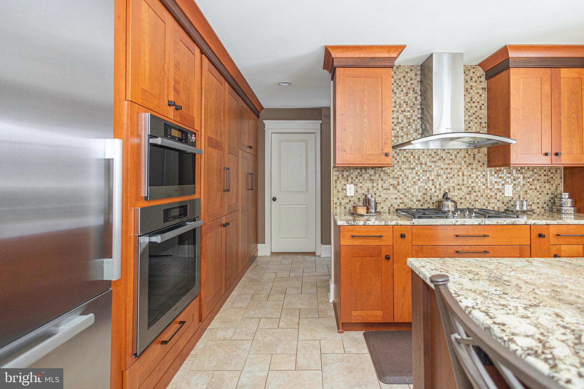 196 Aqueduct Road Washington Crossing, PA 18977 - Photo 33 of 57 a kitchen with stainless steel appliances granite countertop a refrigerator and a stove