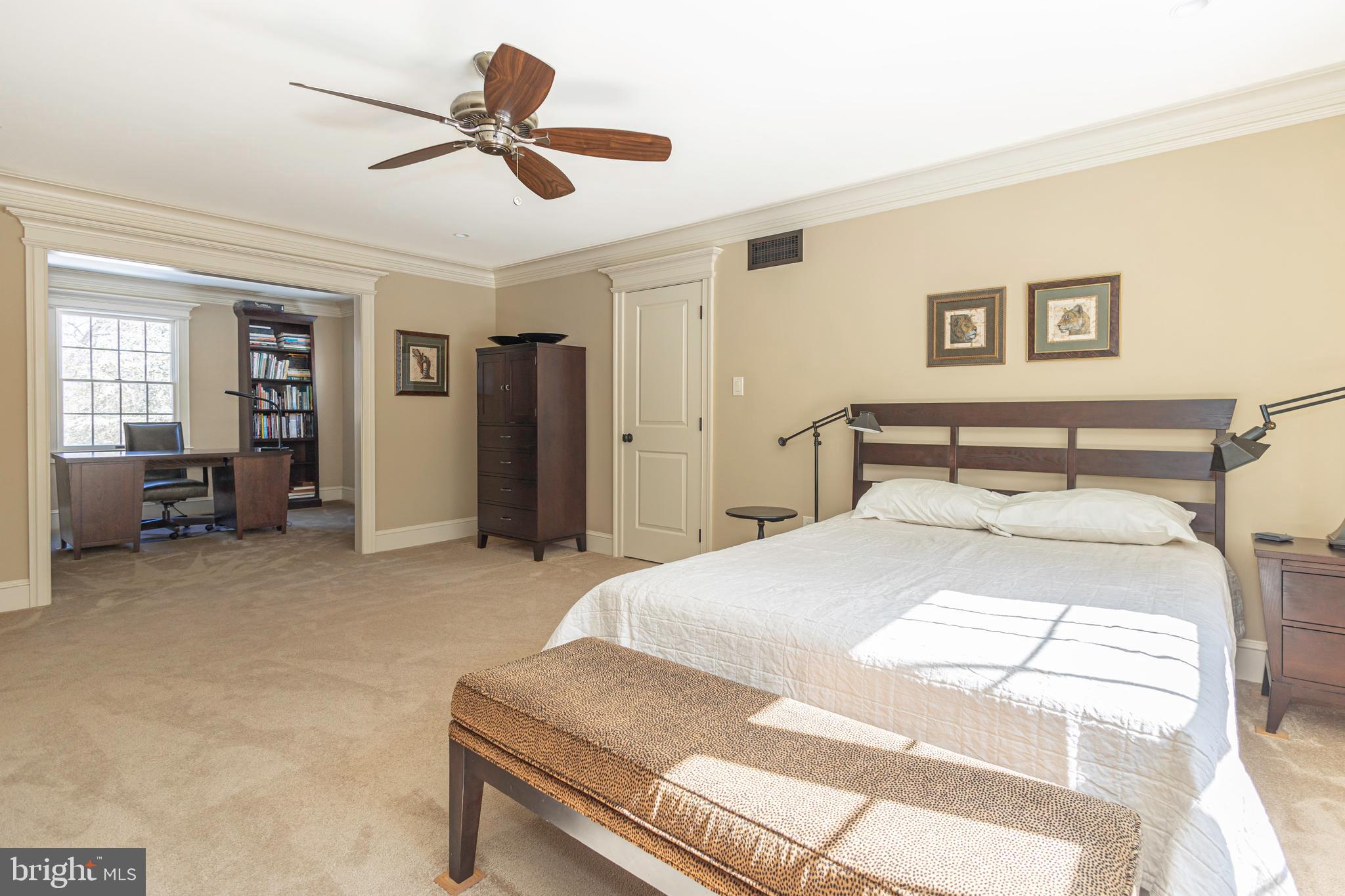 196 Aqueduct Road Washington Crossing, PA 18977 - Photo 37 of 57 a bedroom with a bed and a chandelier