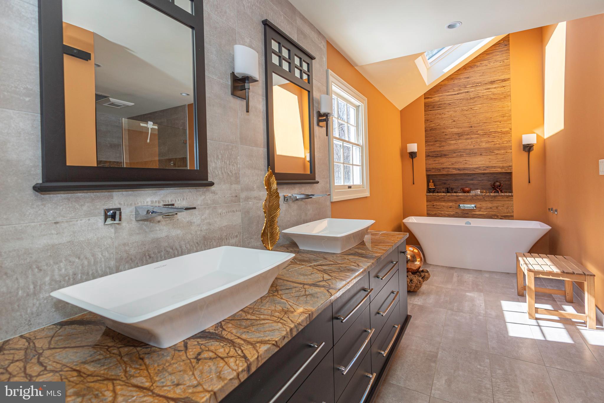 196 Aqueduct Road Washington Crossing, PA 18977 - Photo 41 of 57 a bathroom with a granite countertop sink a mirror a vanity and a bathtub