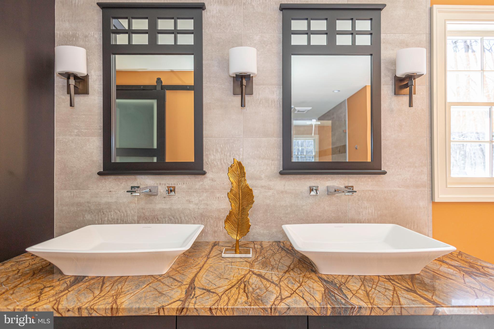 196 Aqueduct Road Washington Crossing, PA 18977 - Photo 45 of 57 a bathroom with a tub sink and mirror