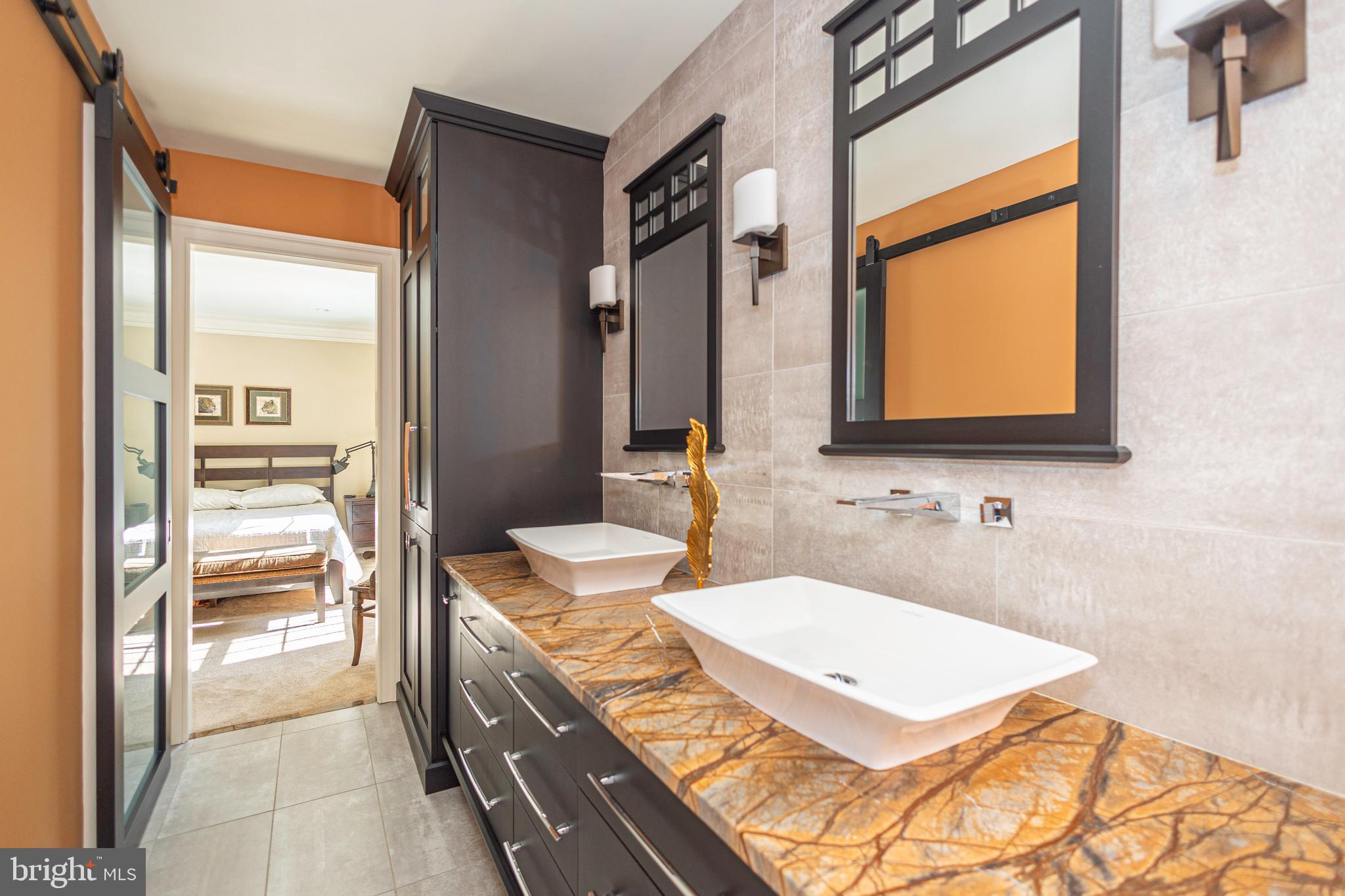 196 Aqueduct Road Washington Crossing, PA 18977 - Photo 46 of 57 a bathroom with a granite countertop sink and a mirror