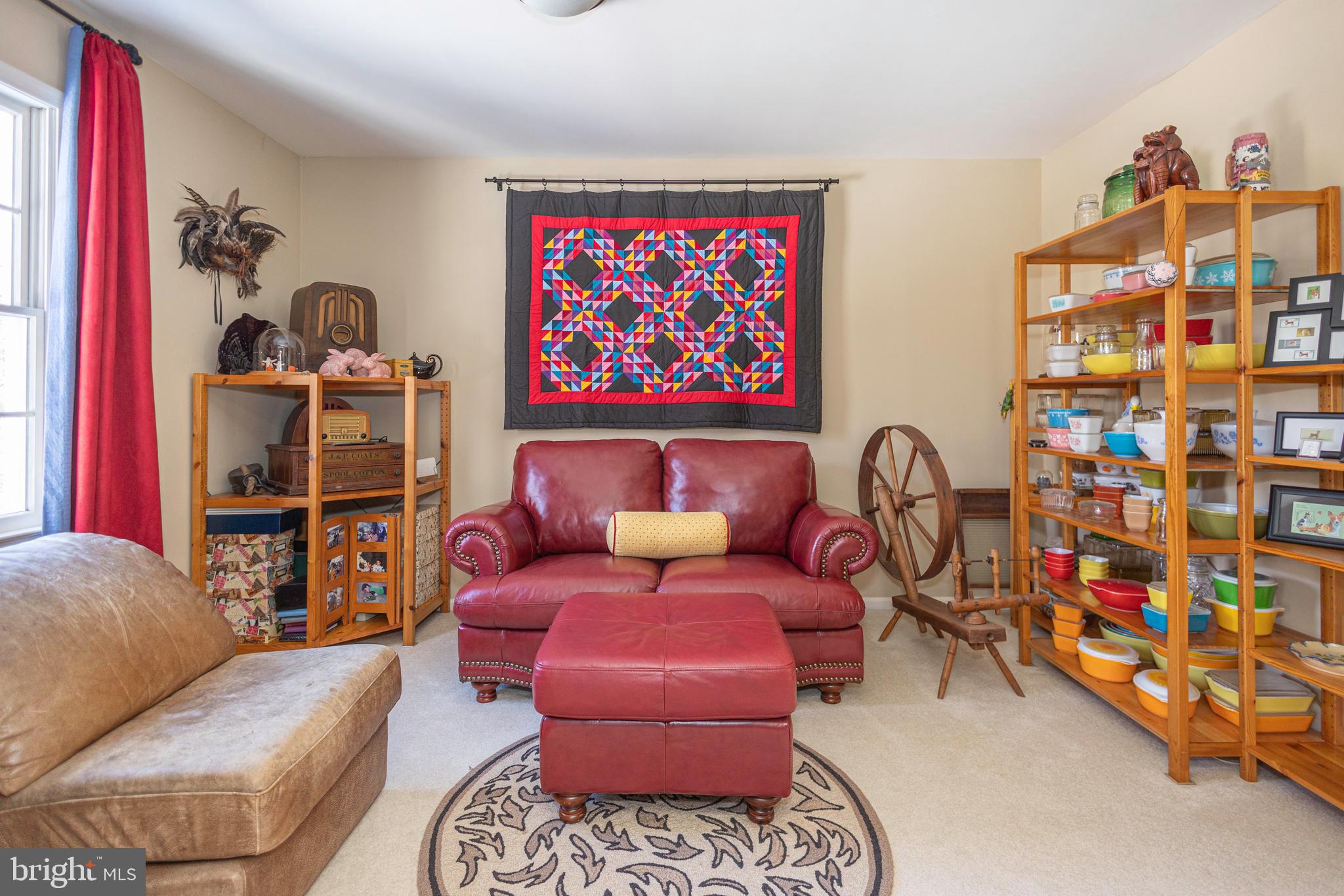 196 Aqueduct Road Washington Crossing, PA 18977 - Photo 48 of 57 a living room with furniture a flat screen tv and a wall painting