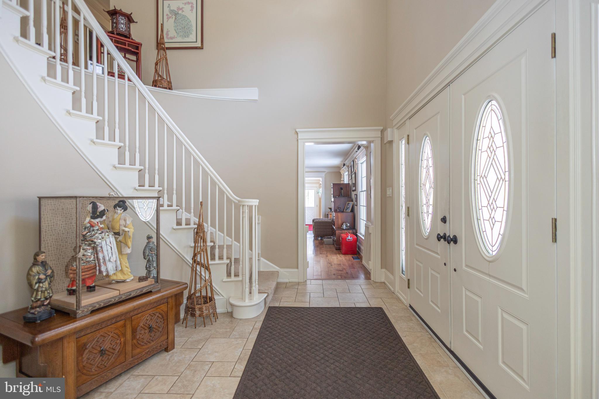 196 Aqueduct Road Washington Crossing, PA 18977 - Photo 6 of 57 a view of an entryway with wooden floor and a livingroom view