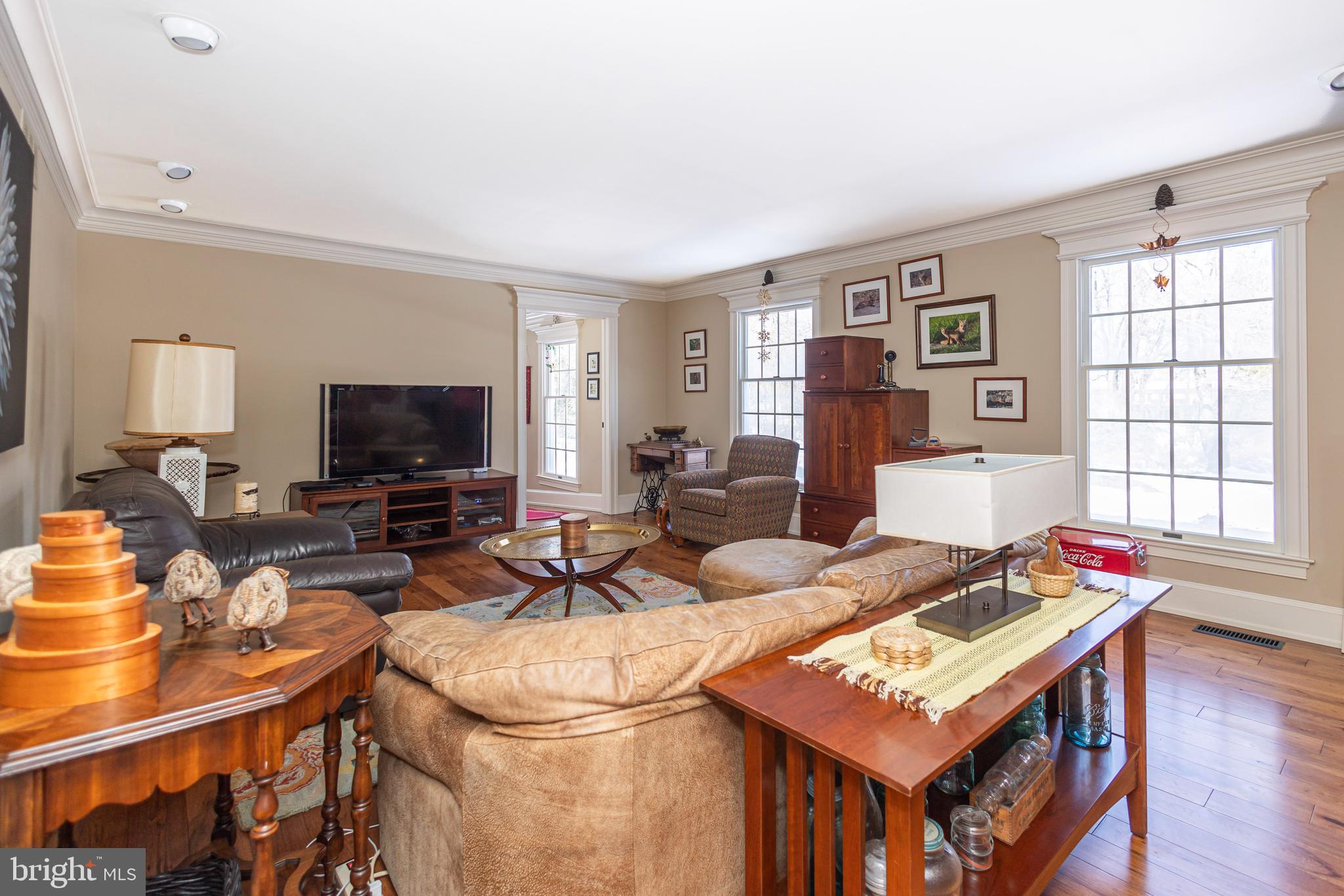 196 Aqueduct Road Washington Crossing, PA 18977 - Photo 9 of 57 a living room with furniture a flat screen tv and a window