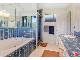 2717 Halsey Road Topanga, CA 90290 - Photo 12 of 39 a bathroom with a tub a sink and a shower