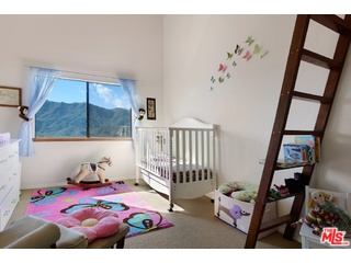 2717 Halsey Road Topanga, CA 90290 - Photo 13 of 39 a bedroom with furniture and a window