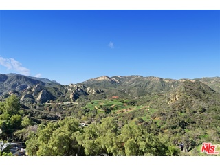 2717 Halsey Road Topanga, CA 90290 - Photo 23 of 39 a view of a large building with mountains in the background