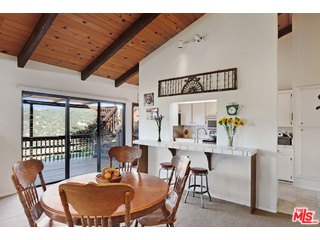 2717 Halsey Road Topanga, CA 90290 - Photo 30 of 39 a dining room with furniture and wooden floor