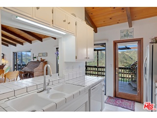 2717 Halsey Road Topanga, CA 90290 - Photo 32 of 39 a kitchen with sink and refrigerator