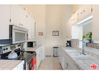 2717 Halsey Road Topanga, CA 90290 - Photo 33 of 39 a kitchen with stainless steel appliances granite countertop a sink stove and cabinets