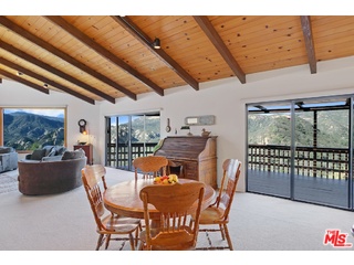 2717 Halsey Road Topanga, CA 90290 - Photo 35 of 39 a dining room with furniture and wooden floor