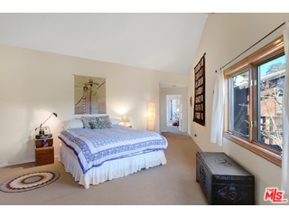 2717 Halsey Road Topanga, CA 90290 - Photo 5 of 39 a bedroom with a bed a mirror and windows