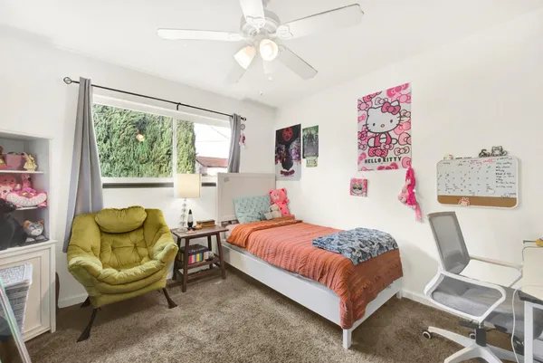 a bedroom with a bed and a couch