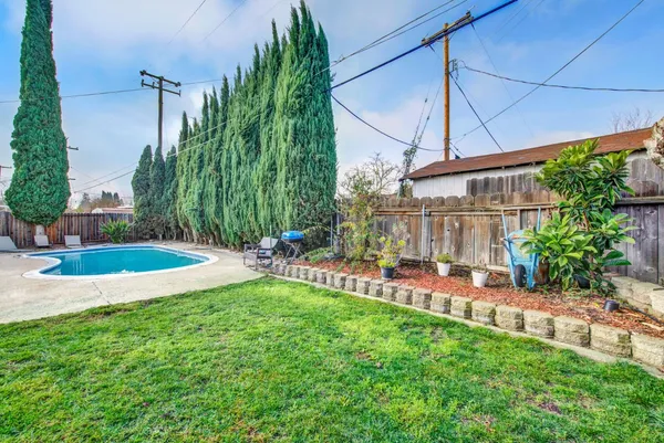 a view of a backyard with a patio