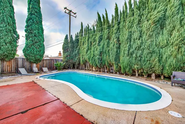 a view of a swimming pool with a patio