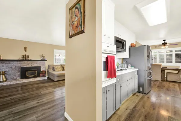 a living room with furniture and a fireplace